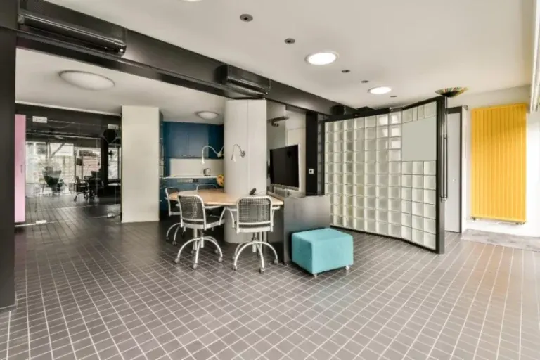 Office with a glass-block wall and breakout seating