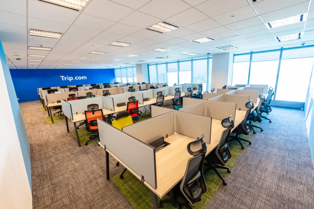 Open-plan workstation floor with acoustic screens, built by CTN