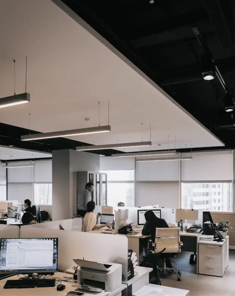 Open-plan office with workstations and a feature ceiling