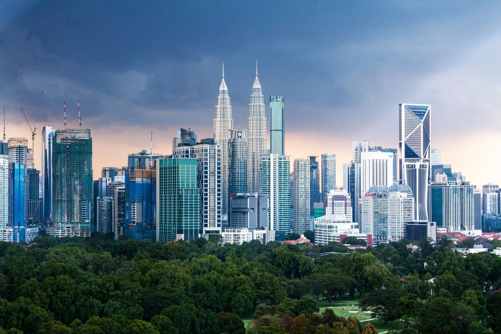 Kuala Lumpur office towers and the city skyline seen across the park