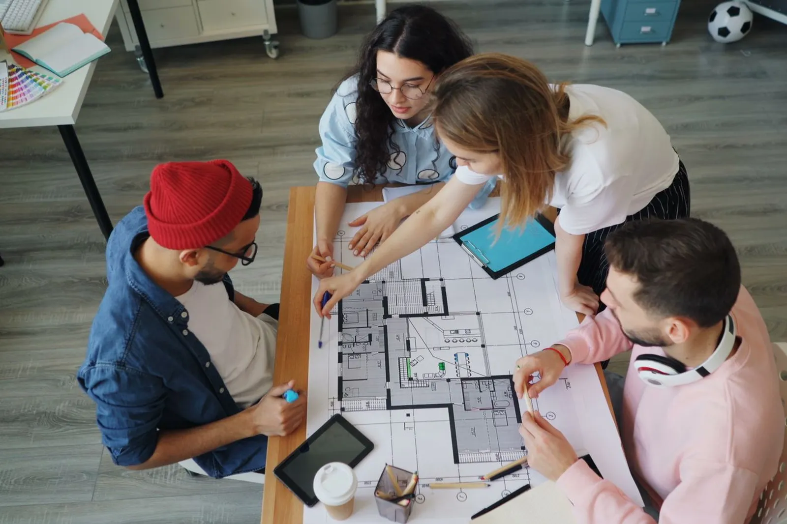 Team reviewing a floor plan and test-fit on the table