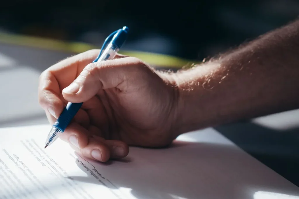 Hand signing an approval document