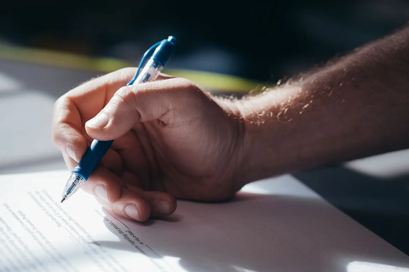 Hand signing an approval document